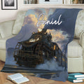 Railroader throw blanket displayed on a sofa with detailed steam train artwork