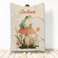 Frog throw blanket featuring a botanical mushroom illustration and woodland-inspired artwork