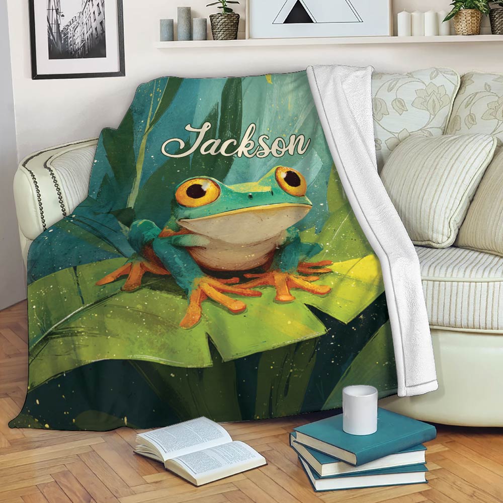 Frog blanket displayed on a sofa with vibrant green foliage, lily pads, and colorful nature artwork
