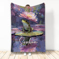 Frog blanket featuring a colorful lily pad pond scene with painterly purple, pink, green, and blue artwork