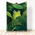 Green frog throw blanket with lush jungle leaves and a cozy lifestyle presentation