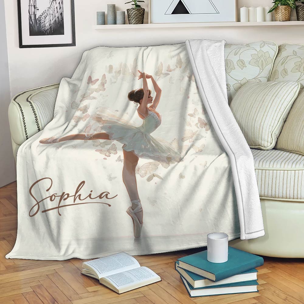 Ballet blanket draped over a sofa with elegant ballerina artwork and soft butterfly details