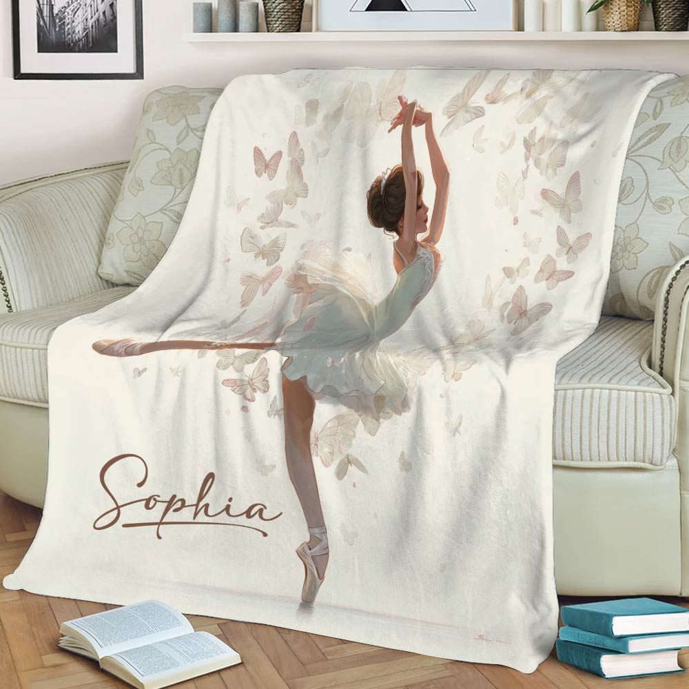 Ballerina throw blanket displayed on a sofa with airy butterfly artwork in soft pastel tones
