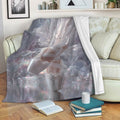 Ballet blanket displayed on a sofa with white ballet slippers, shimmering stars, and soft lavender artwork