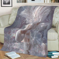 Ballerina throw blanket draped over a sofa with ballet slippers, feathers, and sparkling fantasy details