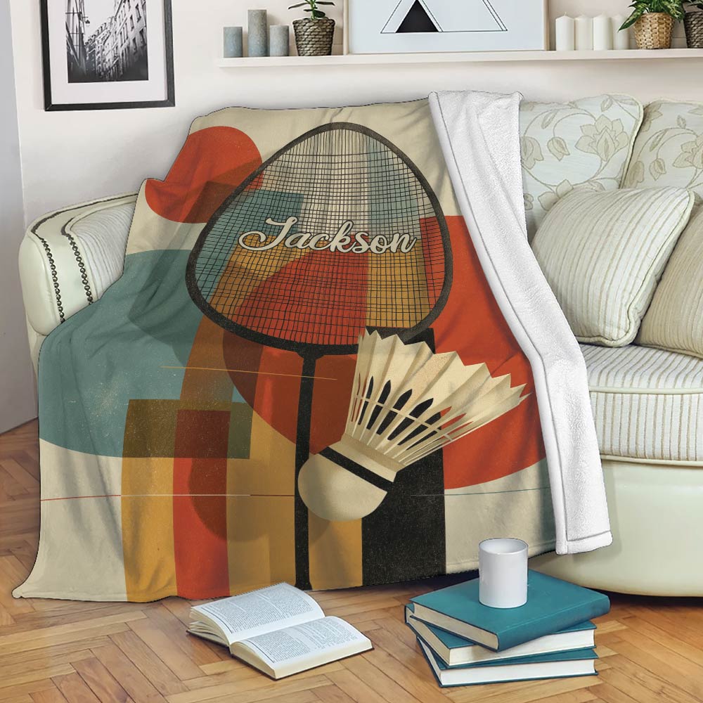 Badminton blanket draped over a sofa with racket and shuttlecock artwork in warm retro colors