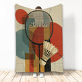 Badminton throw blanket featuring a racket, shuttlecock, and colorful geometric sports artwork