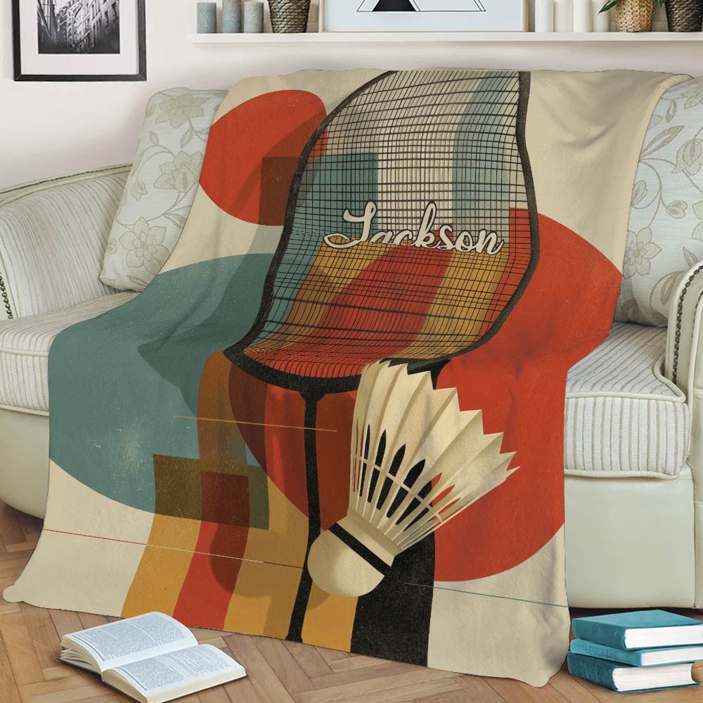 Close view of a badminton throw blanket with racket, shuttlecock, and abstract geometric design