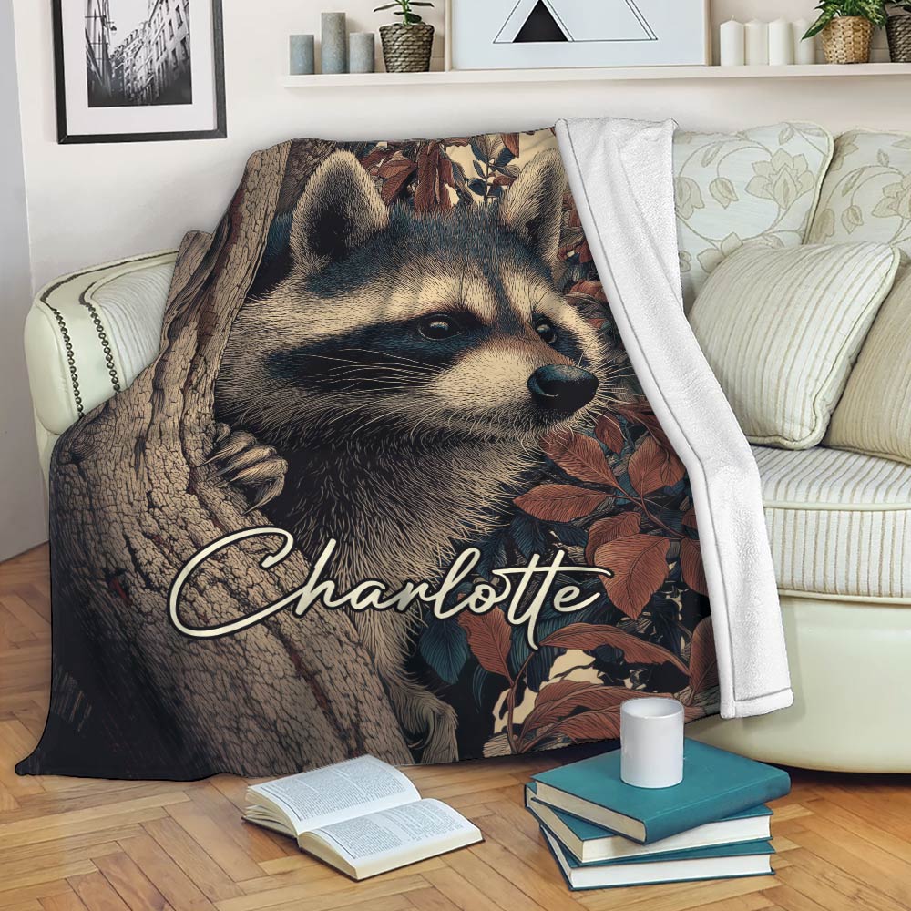 Raccoon blanket draped over a sofa, showing woodland wildlife artwork in a cozy reading space