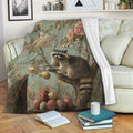 Raccoon throw blanket with botanical artwork draped over a sofa beside books