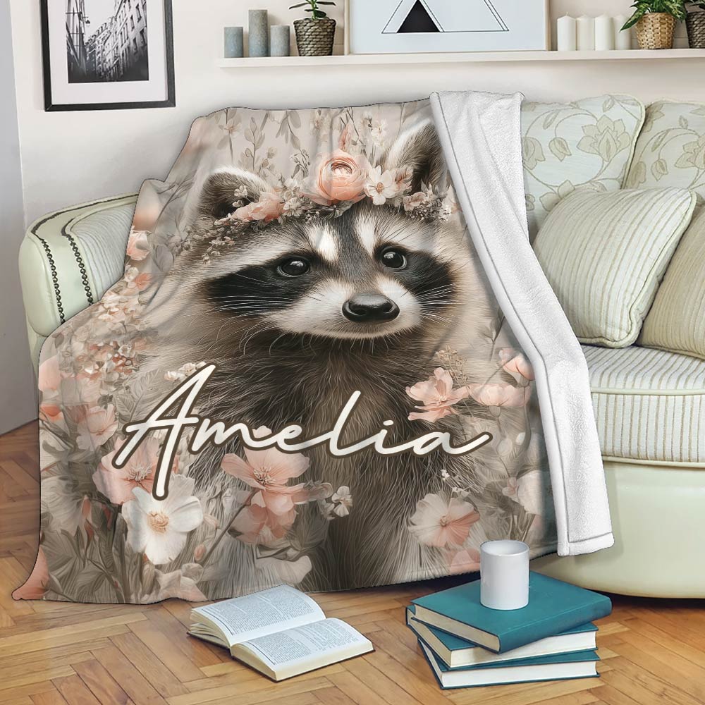 Floral raccoon throw blanket draped over a sofa in a warm living room