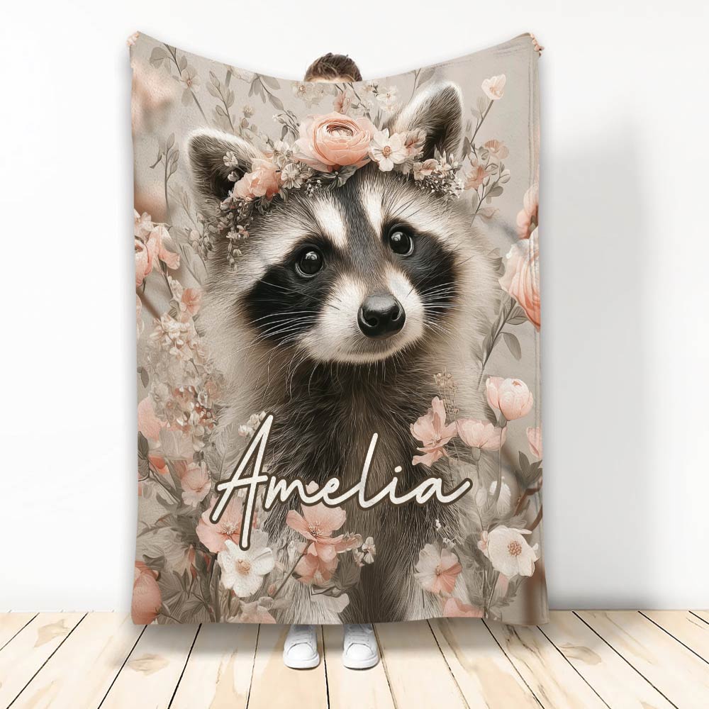 Raccoon throw blanket with floral crown artwork displayed in a cozy home setting