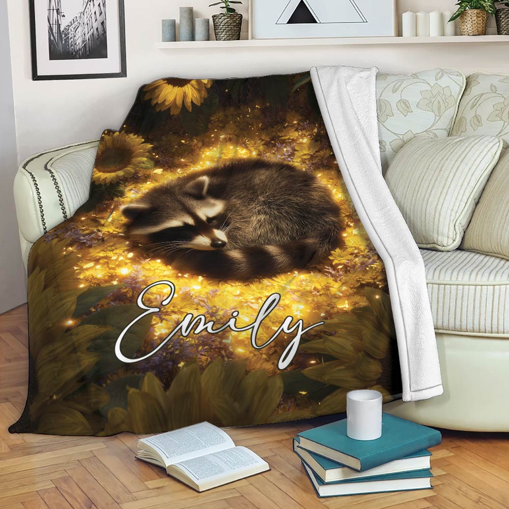 Raccoon blanket draped over a sofa, featuring a sleeping raccoon in a golden sunflower meadow