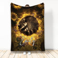 Raccoon throw blanket with a sleeping raccoon surrounded by glowing sunflowers and meadow flowers