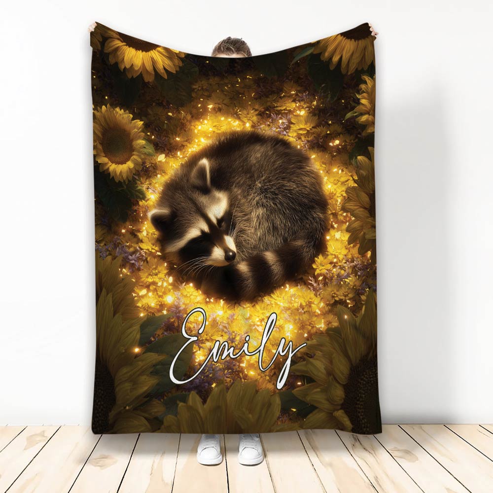 Raccoon throw blanket with a sleeping raccoon surrounded by glowing sunflowers and meadow flowers