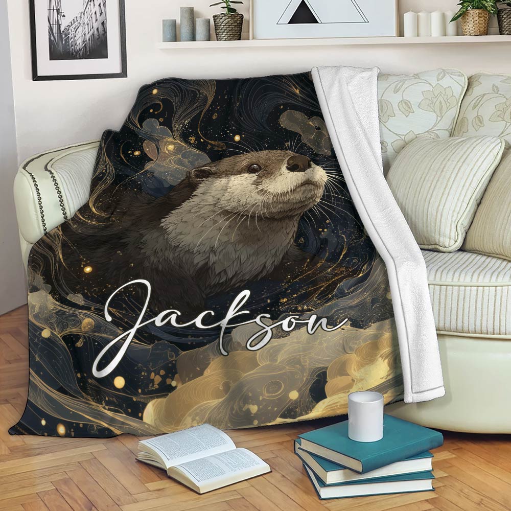 Otter blanket draped over a sofa with a dark celestial-inspired wildlife artwork