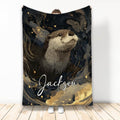 Otter throw blanket with an illustrated wildlife design in black, gold, and deep blue tones