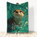Otter throw blanket featuring a close-up swimming otter in teal and green artistic water