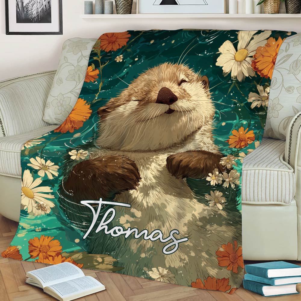 Close view of an illustrated otter and wildflowers displayed on a living room sofa