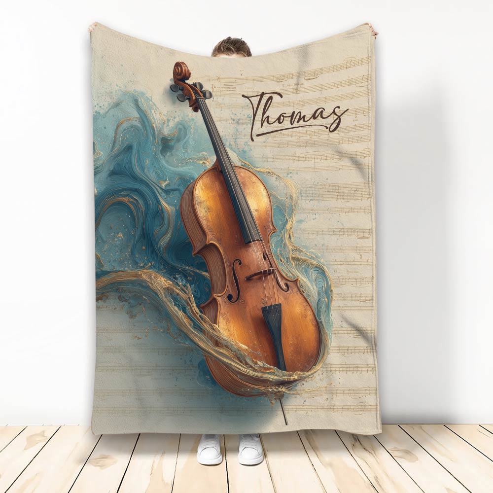 Cello throw blanket displayed with a richly detailed cello, sheet music, and blue marbled artwork