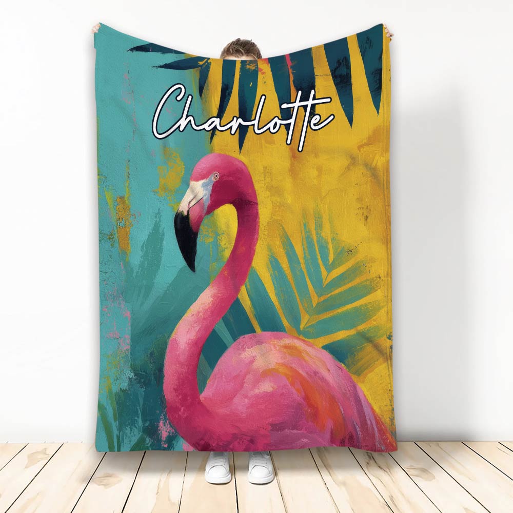 Colorful flamingo throw blanket displayed upright with tropical brushstroke artwork