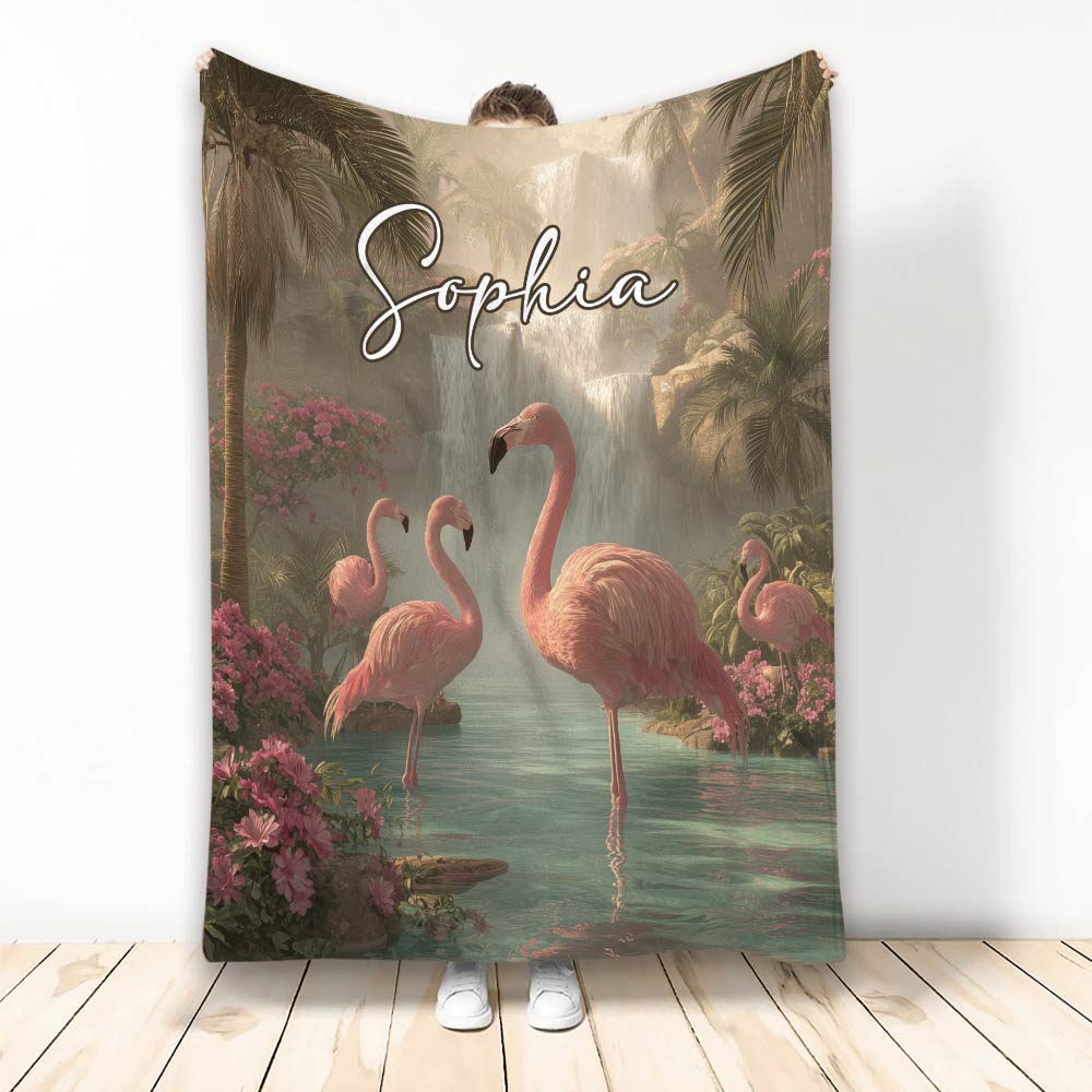Flamingo throw blanket featuring pink flamingos, tropical flowers, palm trees, and a waterfall scene