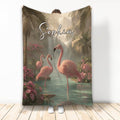 Flamingo throw blanket featuring pink flamingos, tropical flowers, palm trees, and a waterfall scene