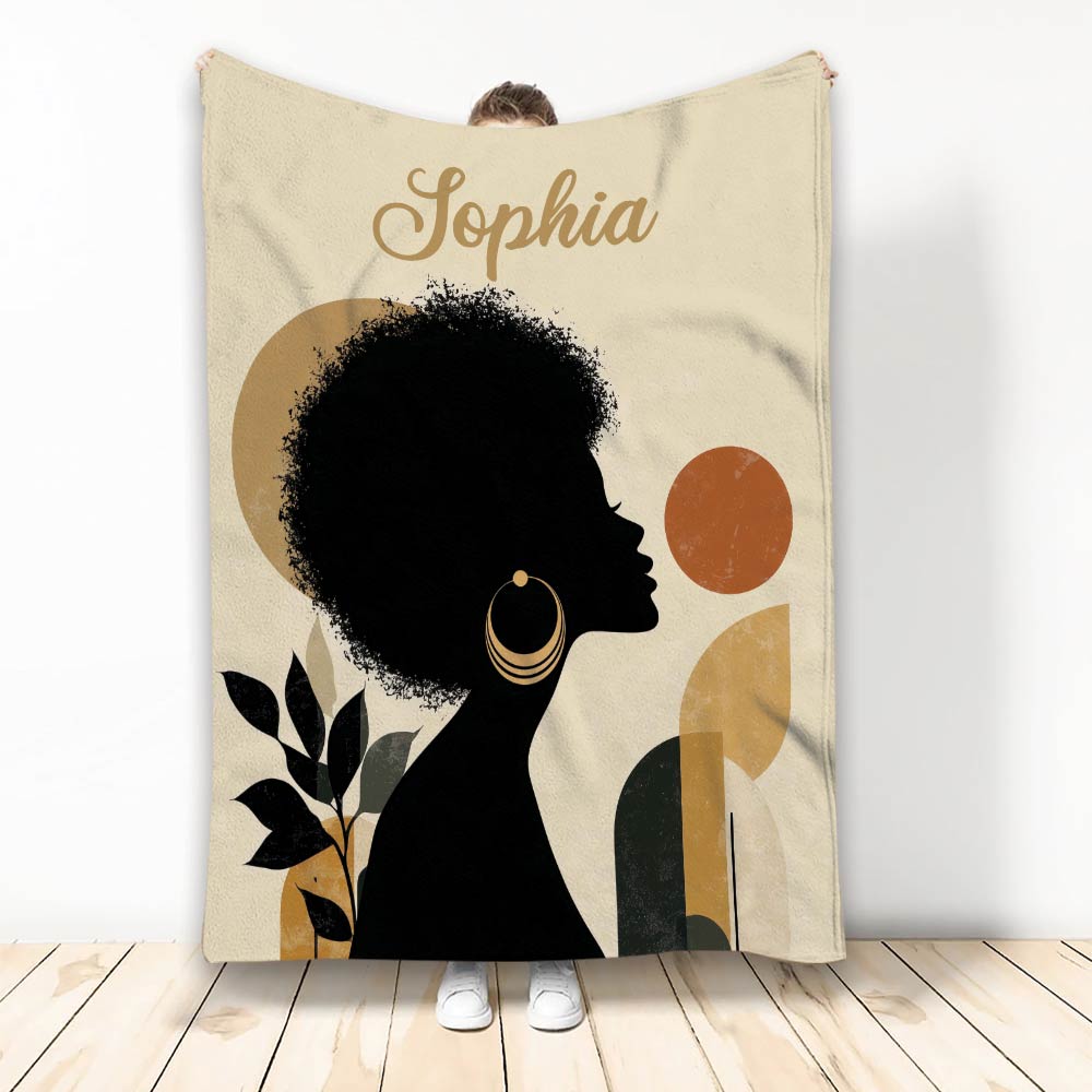 African-inspired throw blanket featuring a Black woman silhouette, botanical leaves, and warm geometric shapes