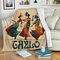 African art throw blanket draped over a sofa with three colorful female figures