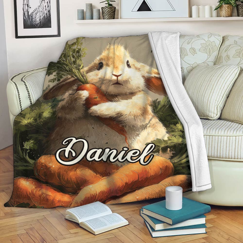 Rabbit throw blanket displayed on a sofa with a carrot-holding bunny and cozy living room decor