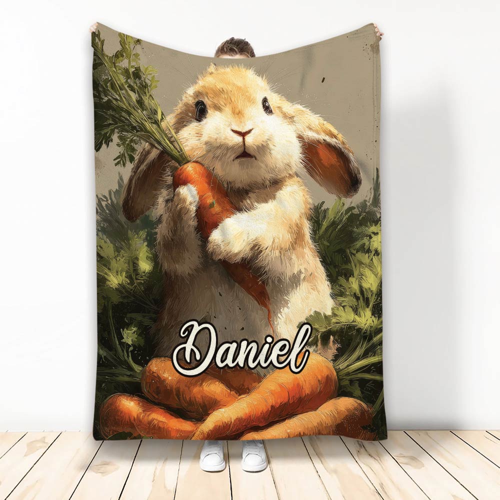 Rabbit blanket design featuring a fluffy bunny holding a carrot among leafy garden greenery