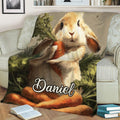 Close view of a rabbit blanket with a detailed bunny, carrots and natural garden artwork
