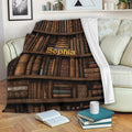 Book bookshelf throw blanket draped over a sofa beside an open book and stacked reading books
