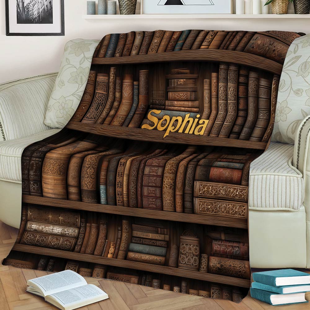 Vintage bookcase blanket styled on a sofa with open and stacked books in a reading nook