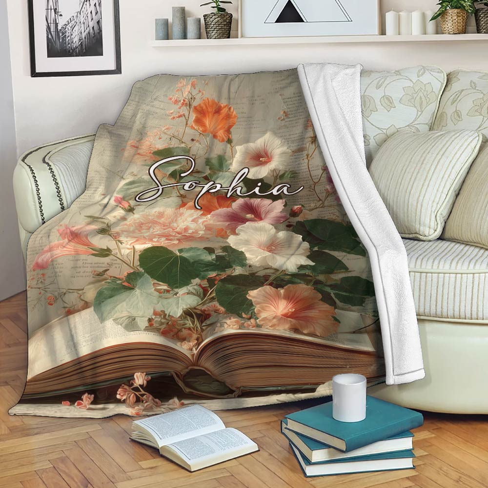 Floral book-themed blanket draped over a sofa in a cozy reading room