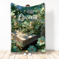 Book-themed blanket featuring an open book surrounded by blooming flowers and soft garden light