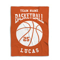 Orange basketball blanket shown flat with a large white basketball graphic and bold athletic typography