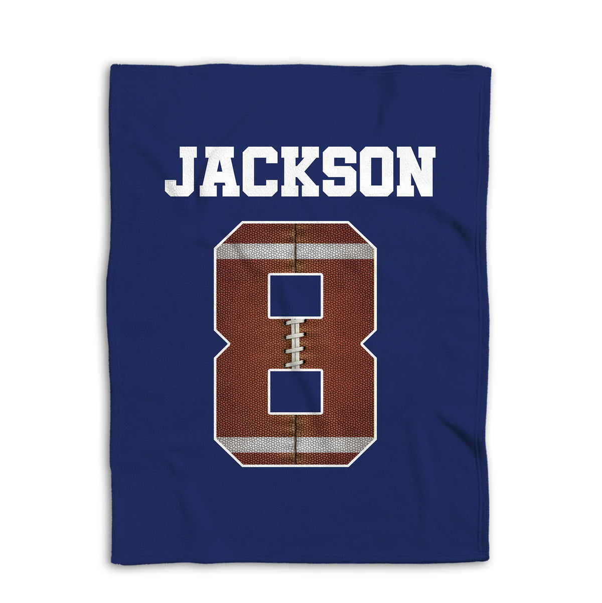 Navy football blanket shown flat with a large textured football design