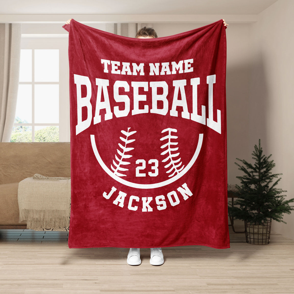 Red baseball throw blanket featuring white baseball lettering and a curved baseball design