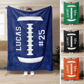 Football throw blanket displayed in blue, green, black, and orange color options with bold sports artwork