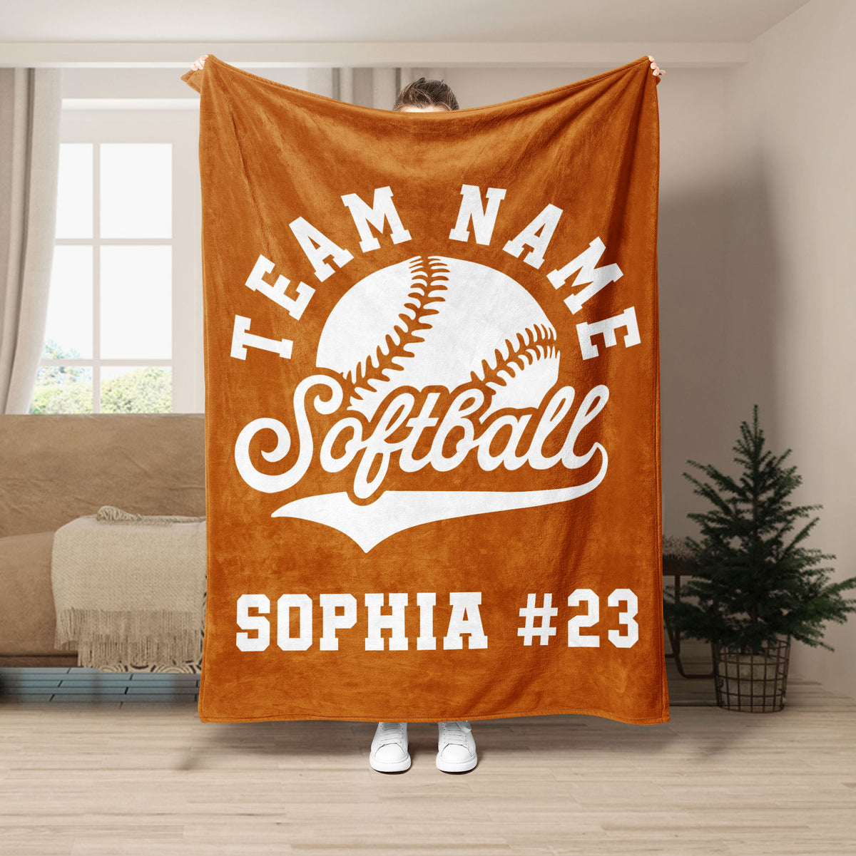 Orange softball throw blanket with white softball artwork and strong team spirit styling