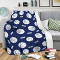 Navy basketball throw blanket draped over a sofa in a cozy living room