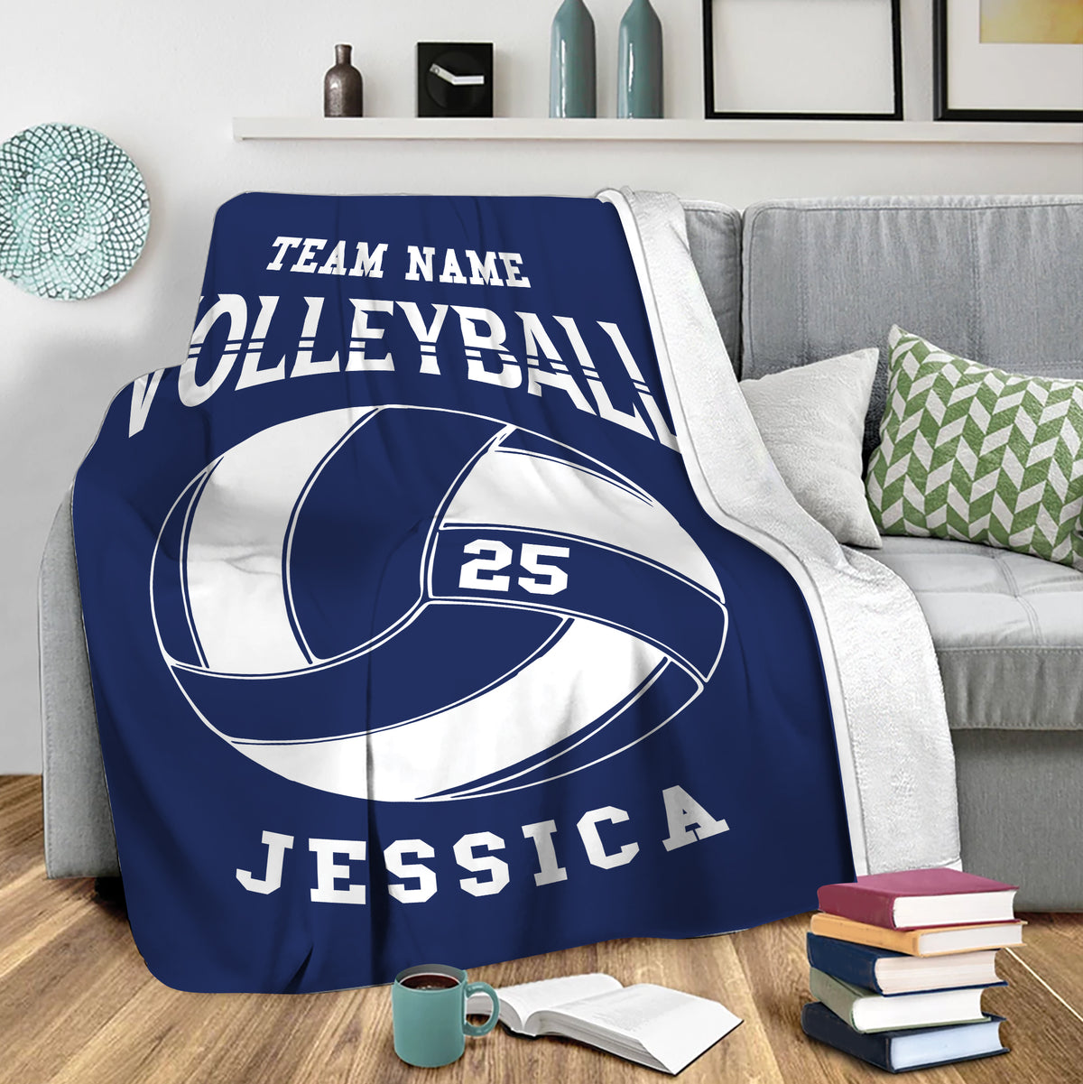 Navy volleyball blanket draped over a sofa with bold sports artwork for lounge decor