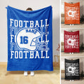 Blue football blanket with helmet artwork and bold collegiate-style sports design