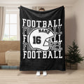 Black football blanket with white helmet artwork and strong athletic lettering