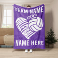 Purple volleyball blanket displayed with white volleyball heart design in a room setting