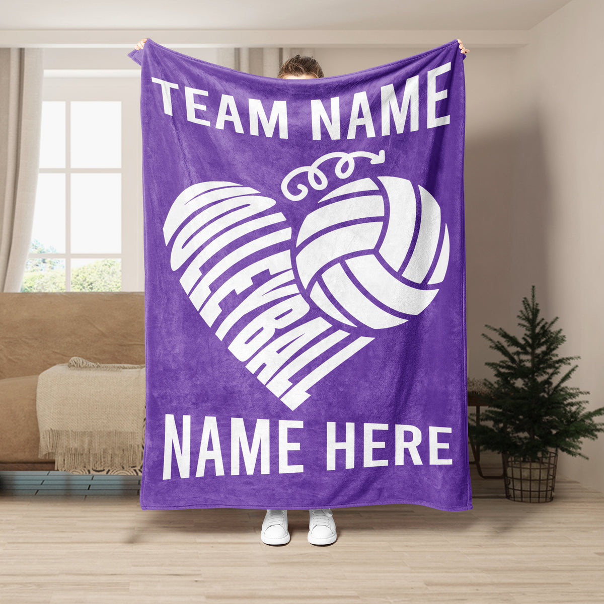 Purple volleyball blanket displayed with white volleyball heart design in a room setting