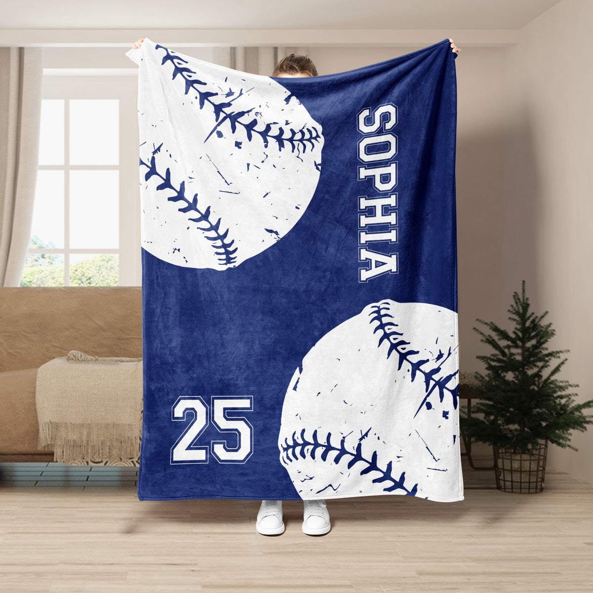 Navy softball throw blanket featuring large stitched ball graphics and bold athletic-style numbers