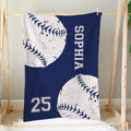 Navy softball blanket hanging on a wooden frame with oversized stitched ball artwork