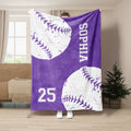Purple softball throw blanket displayed with oversized white stitched balls and bold sports artwork